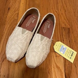 Toms Classic Slip-ons. Natural Daisy Metallic. size 6.5. New with tag and box.